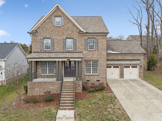 view of front of home with a front yard, a porch, and a garage