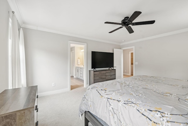 bedroom featuring ceiling fan, crown molding, ensuite bathroom, and light carpet