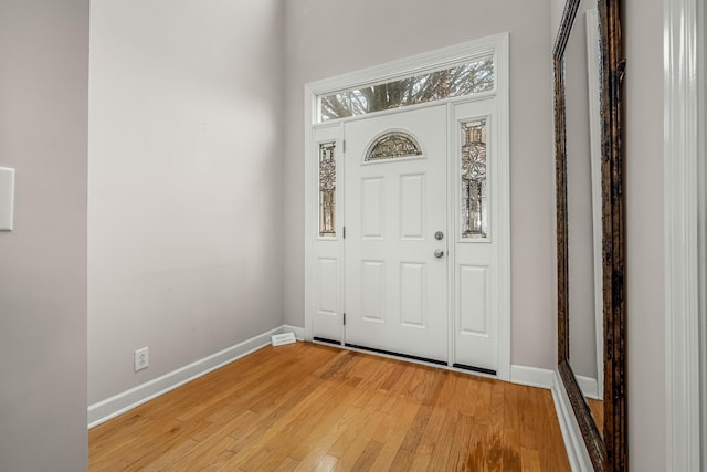 foyer entrance with light hardwood / wood-style flooring