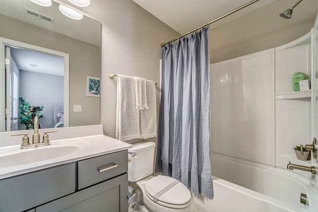 full bathroom featuring toilet, vanity, and shower / tub combo with curtain