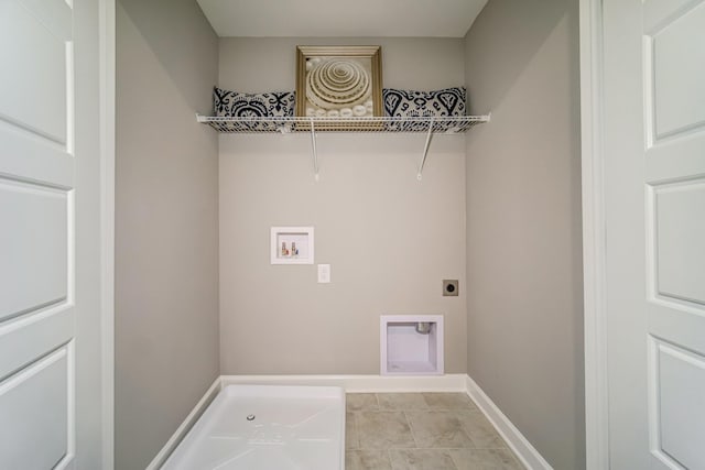 washroom featuring hookup for an electric dryer, washer hookup, and light tile patterned flooring