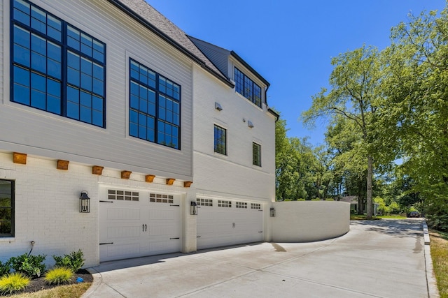 view of side of property with a garage