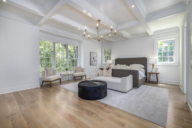 bedroom with an inviting chandelier, beam ceiling, and multiple windows