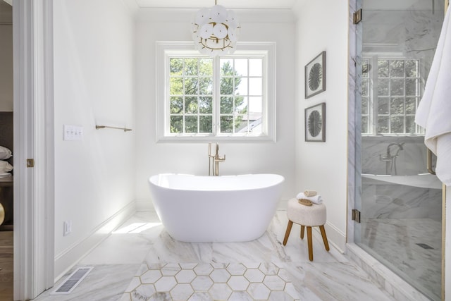 bathroom featuring an inviting chandelier, separate shower and tub, and crown molding