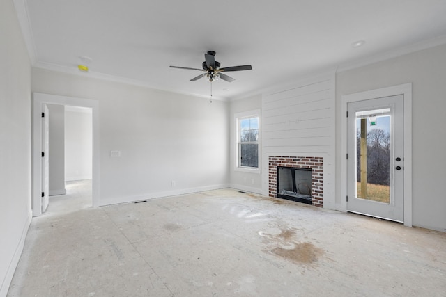 unfurnished living room featuring ceiling fan, crown molding, and a brick fireplace