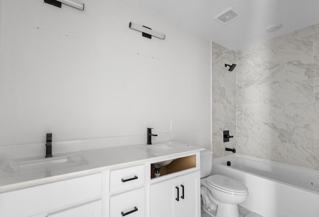 bathroom featuring shower / washtub combination, toilet, visible vents, and a sink