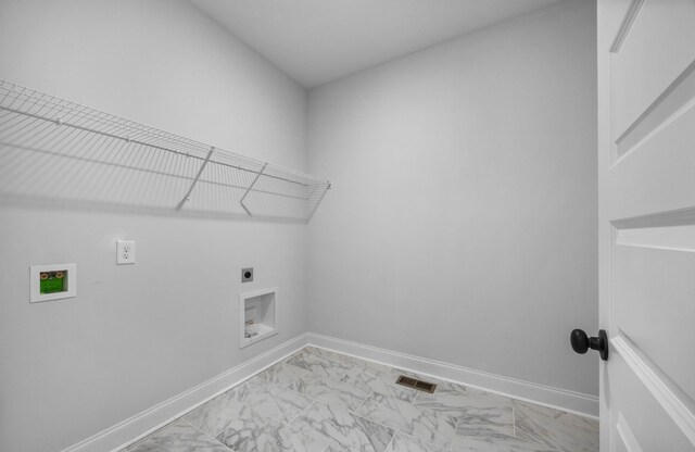 983 Palmyra Rd, Clarksville, TN 37040 - washroom with hookup for an electric dryer, light marble finish flooring, washer hookup, and baseboards