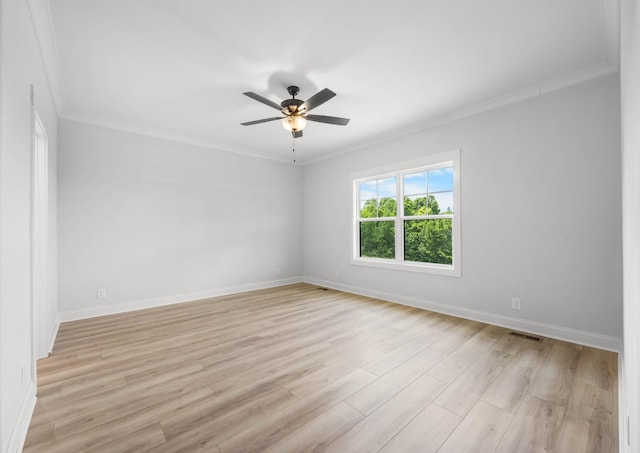 983 Palmyra Rd, Clarksville, TN 37040 - spare room featuring ornamental molding, ceiling fan, light wood-style floors, and baseboards