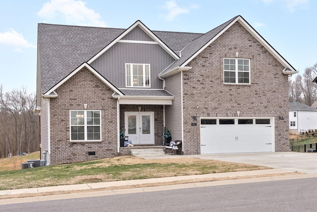 view of front of property featuring french doors and a garage