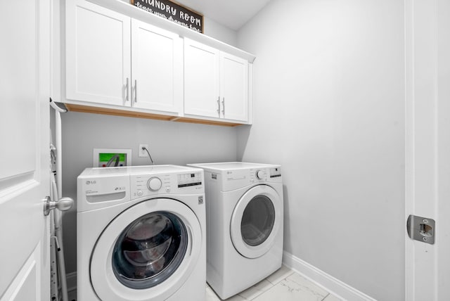 laundry room featuring cabinets and independent washer and dryer