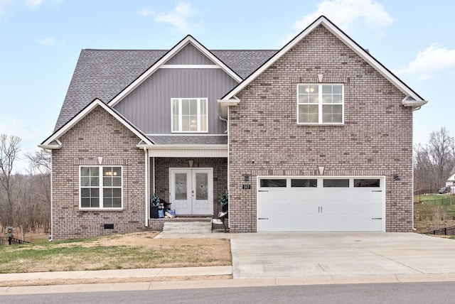 view of front of home with french doors and a garage