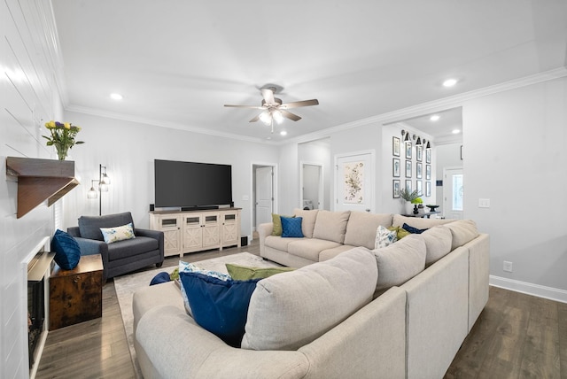 living room with ceiling fan, ornamental molding, and dark wood-type flooring