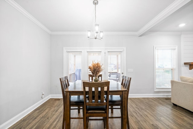 dining room with a notable chandelier, dark hardwood / wood-style floors, and ornamental molding