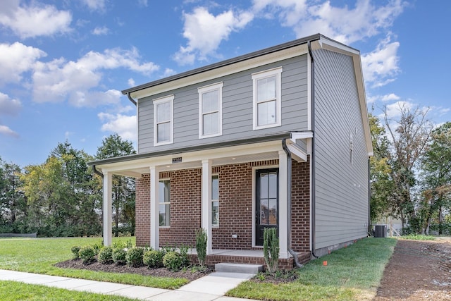 view of front of home featuring a front yard and a porch