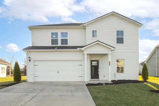 view of front of property with a garage and a front lawn