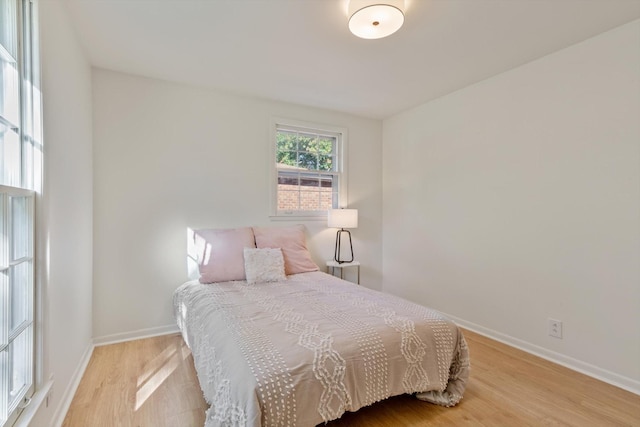 bedroom with light wood-type flooring