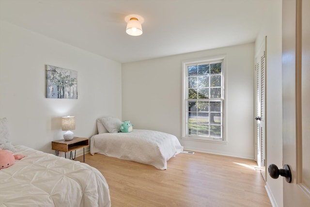 bedroom with light hardwood / wood-style flooring