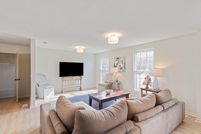 living room with light hardwood / wood-style floors