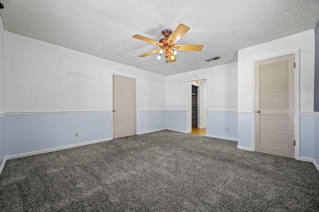 interior space featuring ceiling fan and a textured ceiling