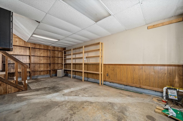 garage featuring wooden walls