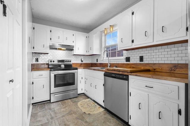 kitchen with sink, decorative backsplash, butcher block countertops, white cabinetry, and stainless steel appliances