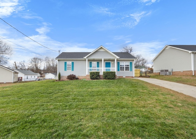 view of front of house with covered porch, central air condition unit, and a front lawn