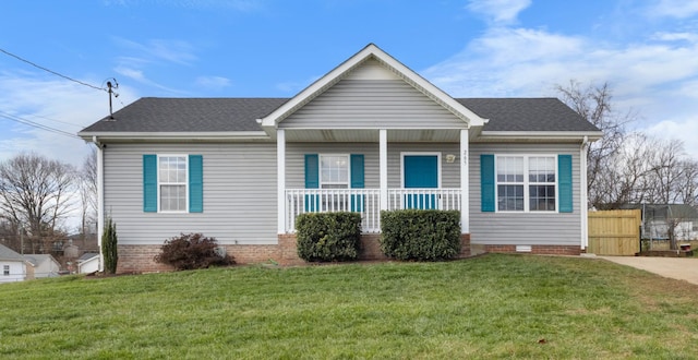 view of front of home featuring covered porch and a front lawn