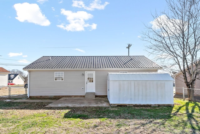 back of property featuring a patio area and a yard