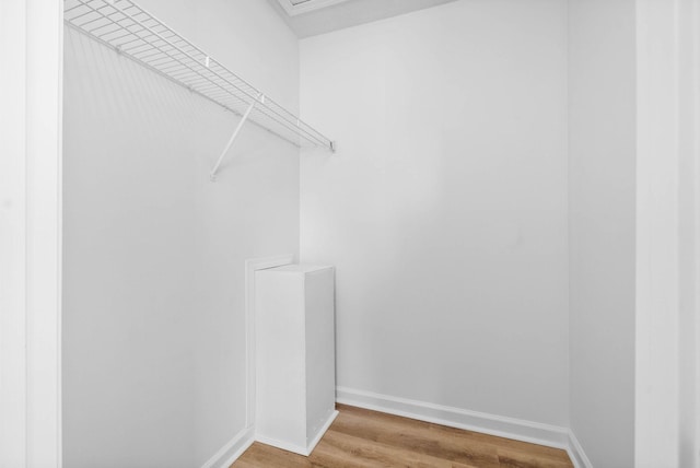 walk in closet featuring hardwood / wood-style floors