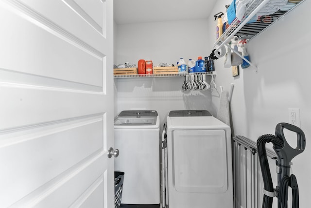 laundry room featuring separate washer and dryer