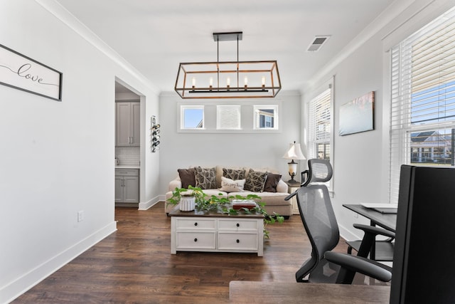 office featuring dark wood-type flooring, an inviting chandelier, and ornamental molding