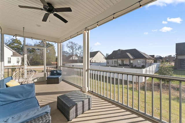 sunroom / solarium featuring ceiling fan and a healthy amount of sunlight