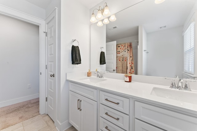 bathroom with vanity and tile patterned floors