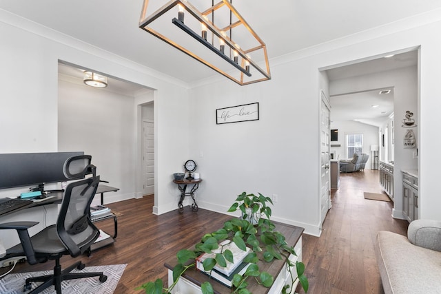 office space featuring dark hardwood / wood-style flooring, ornamental molding, and a chandelier