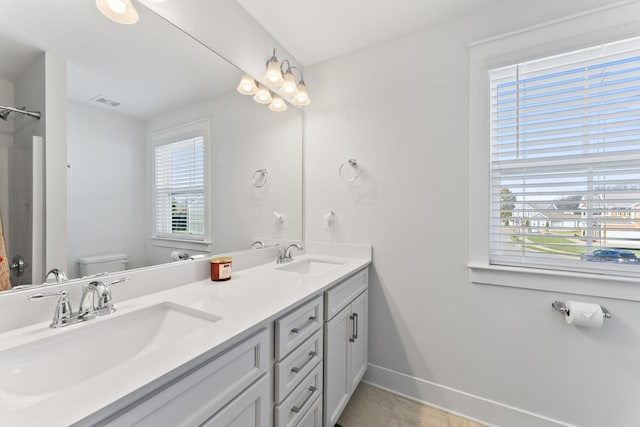 bathroom with vanity and toilet