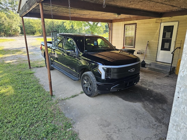 exterior space with a carport