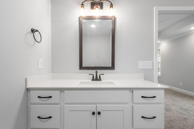 bathroom with baseboards and vanity