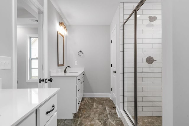 bathroom with visible vents, baseboards, a shower stall, and vanity