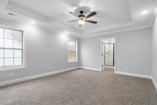 carpeted empty room featuring baseboards, visible vents, a raised ceiling, ceiling fan, and recessed lighting