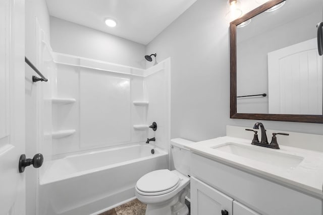 bathroom featuring toilet, shower / bathtub combination, and vanity