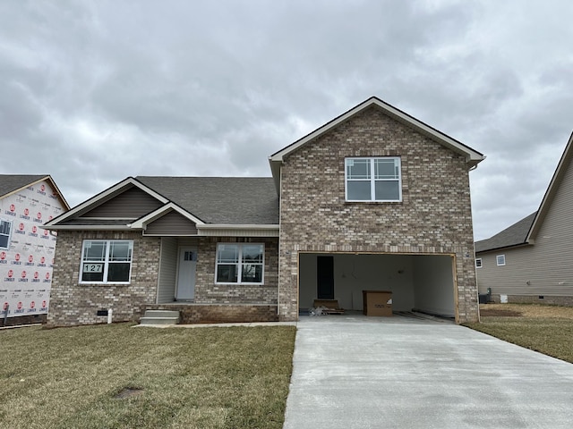 view of front of house with driveway, an attached garage, a front lawn, and brick siding