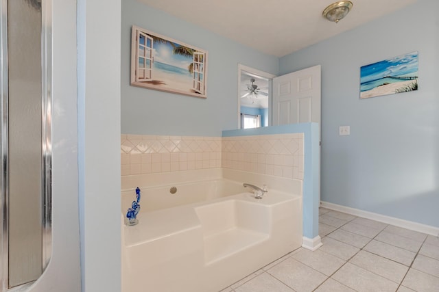 bathroom featuring tile patterned floors, ceiling fan, and a bathing tub