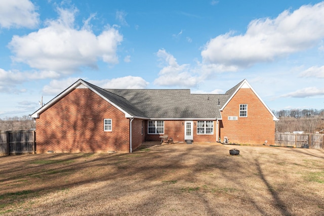 back of house with a yard