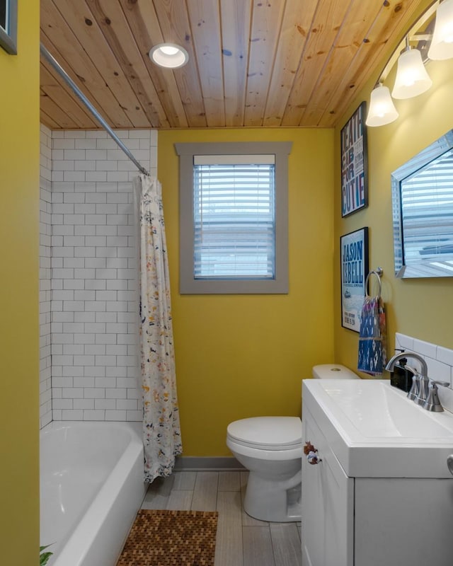 full bathroom featuring vanity, toilet, shower / bath combo with shower curtain, and wood ceiling