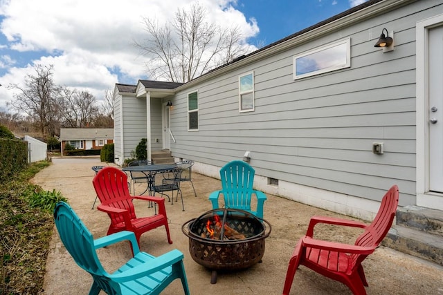 view of patio with a fire pit