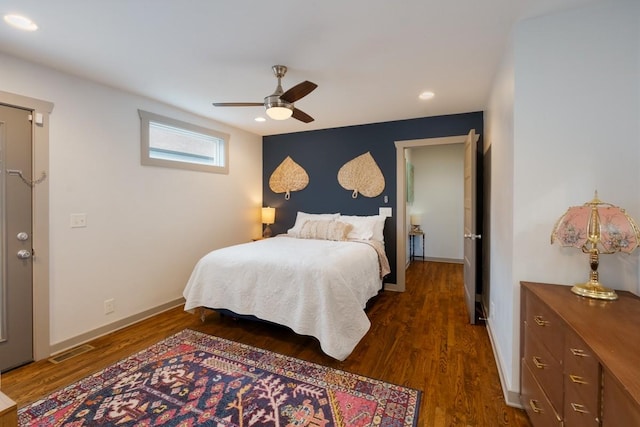 bedroom featuring ceiling fan and dark wood-type flooring