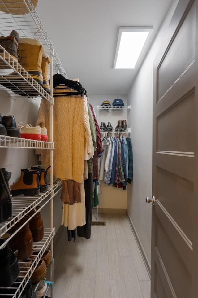 walk in closet featuring wood-type flooring