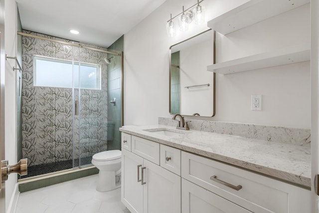 bathroom with an enclosed shower, vanity, toilet, and tile patterned floors