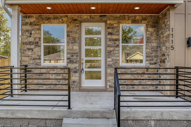 view of exterior entry with covered porch