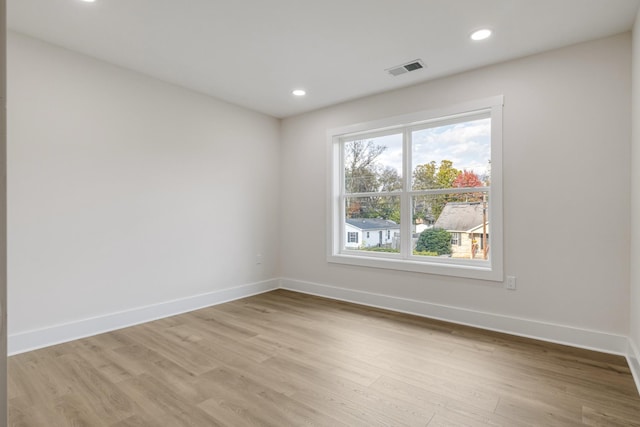 spare room featuring light wood-type flooring